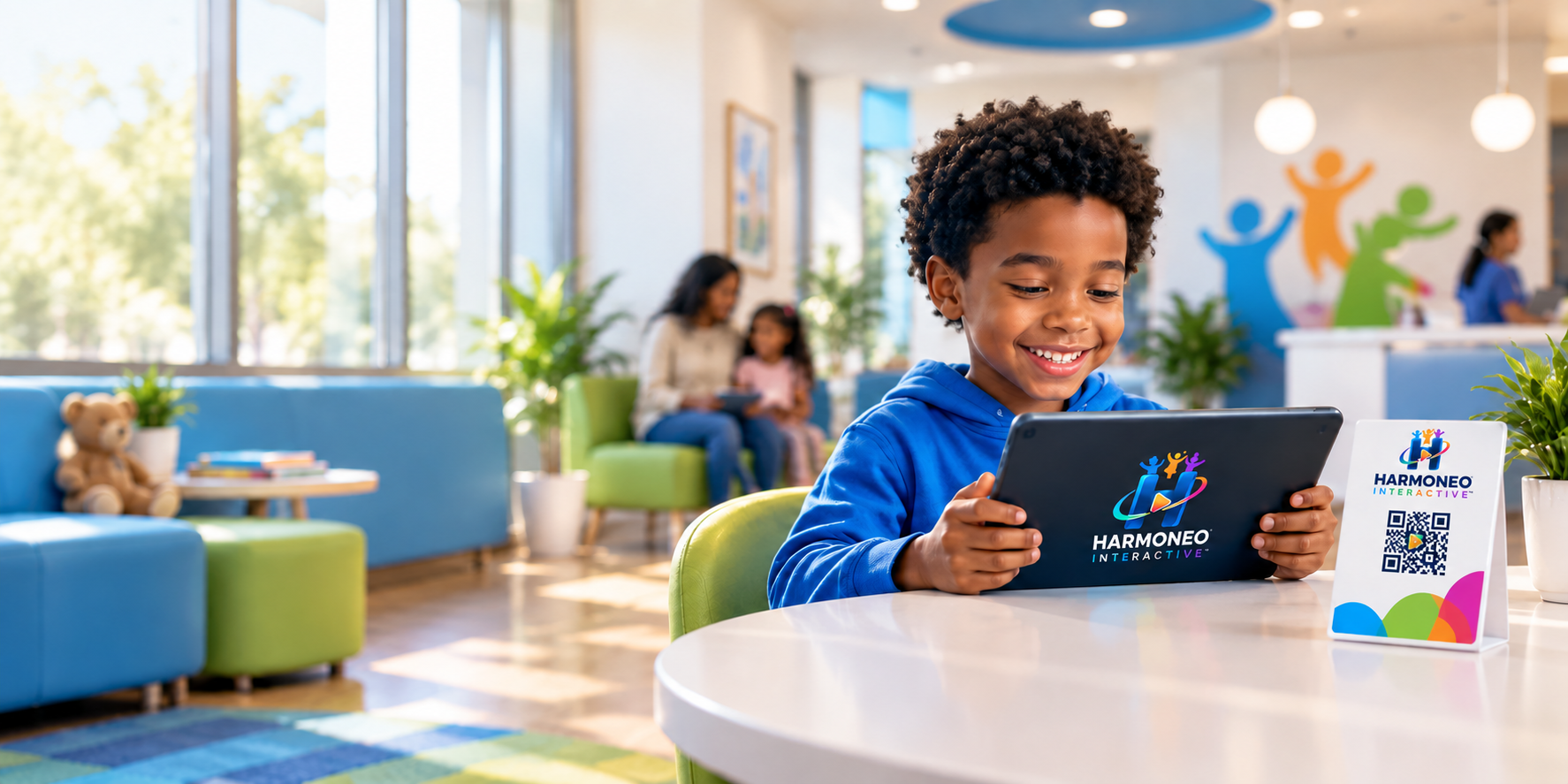 A child enjoying an interactive tablet experience in a welcoming family waiting space